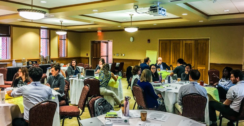 Participants working in small group sessions at the science-policy dialogue discussing concepts of livability and equity in sustainable cities. 